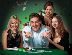 A high roller whale throwing casino chips in the air surrounded by beautiful women
